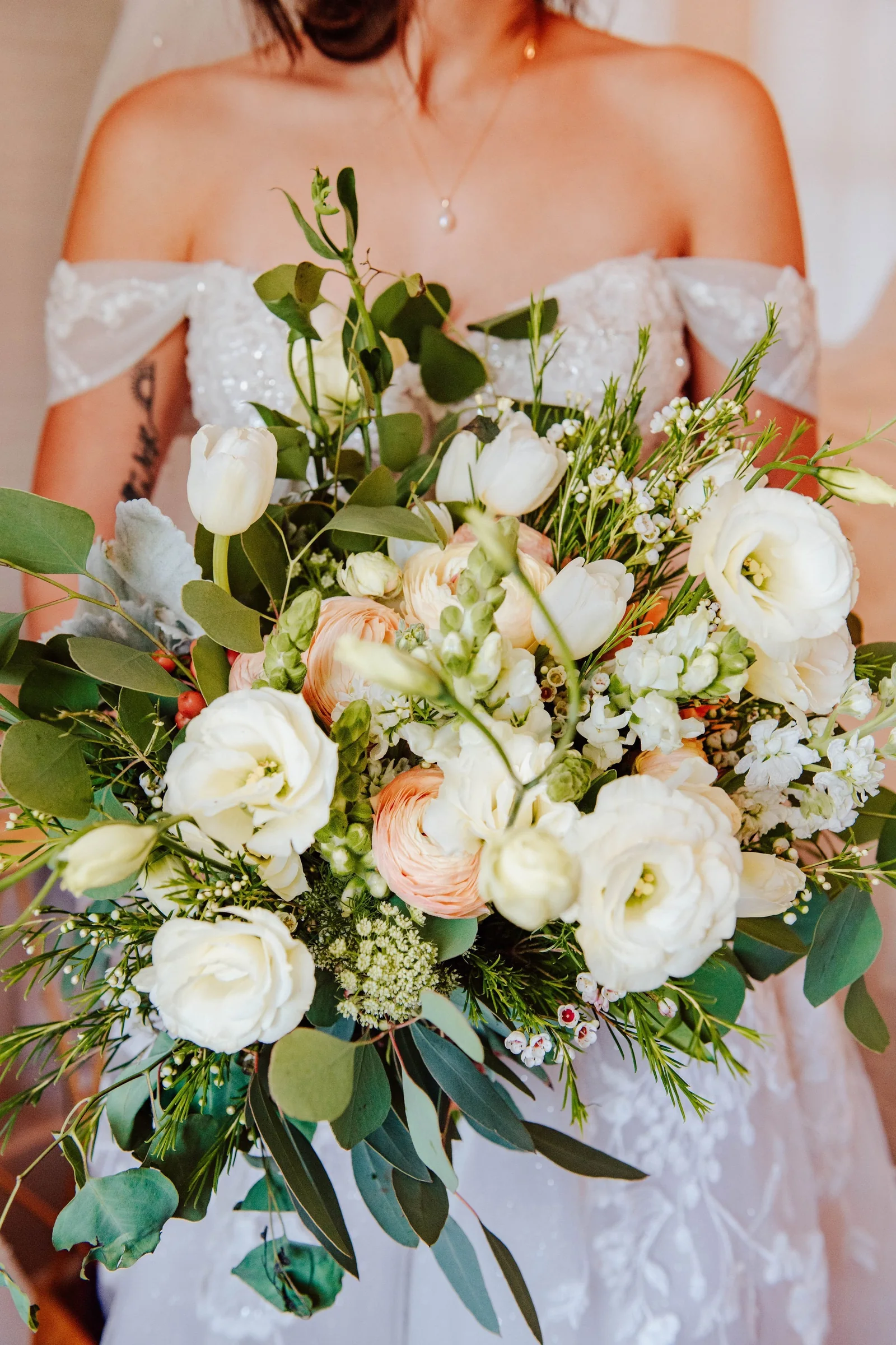 Bridal bouquet and dress detail before the ceremony