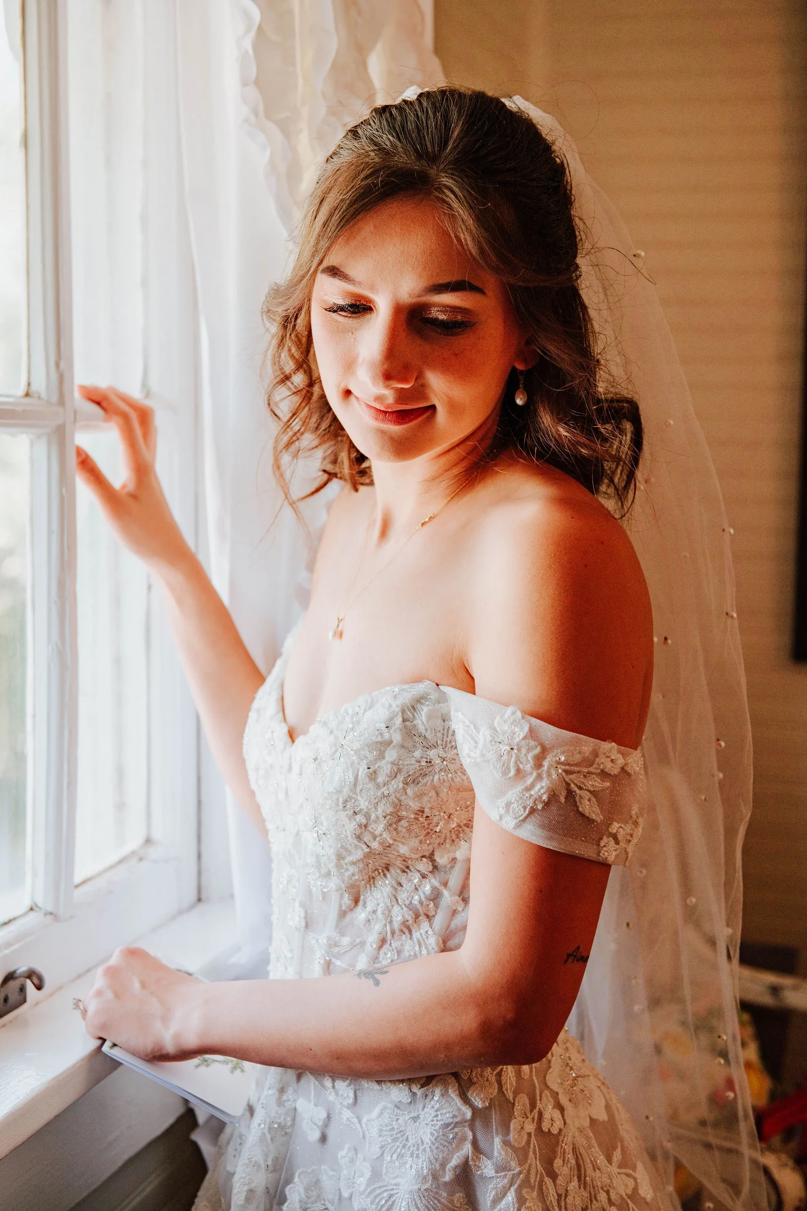 Bride seated with bouquet before the ceremony