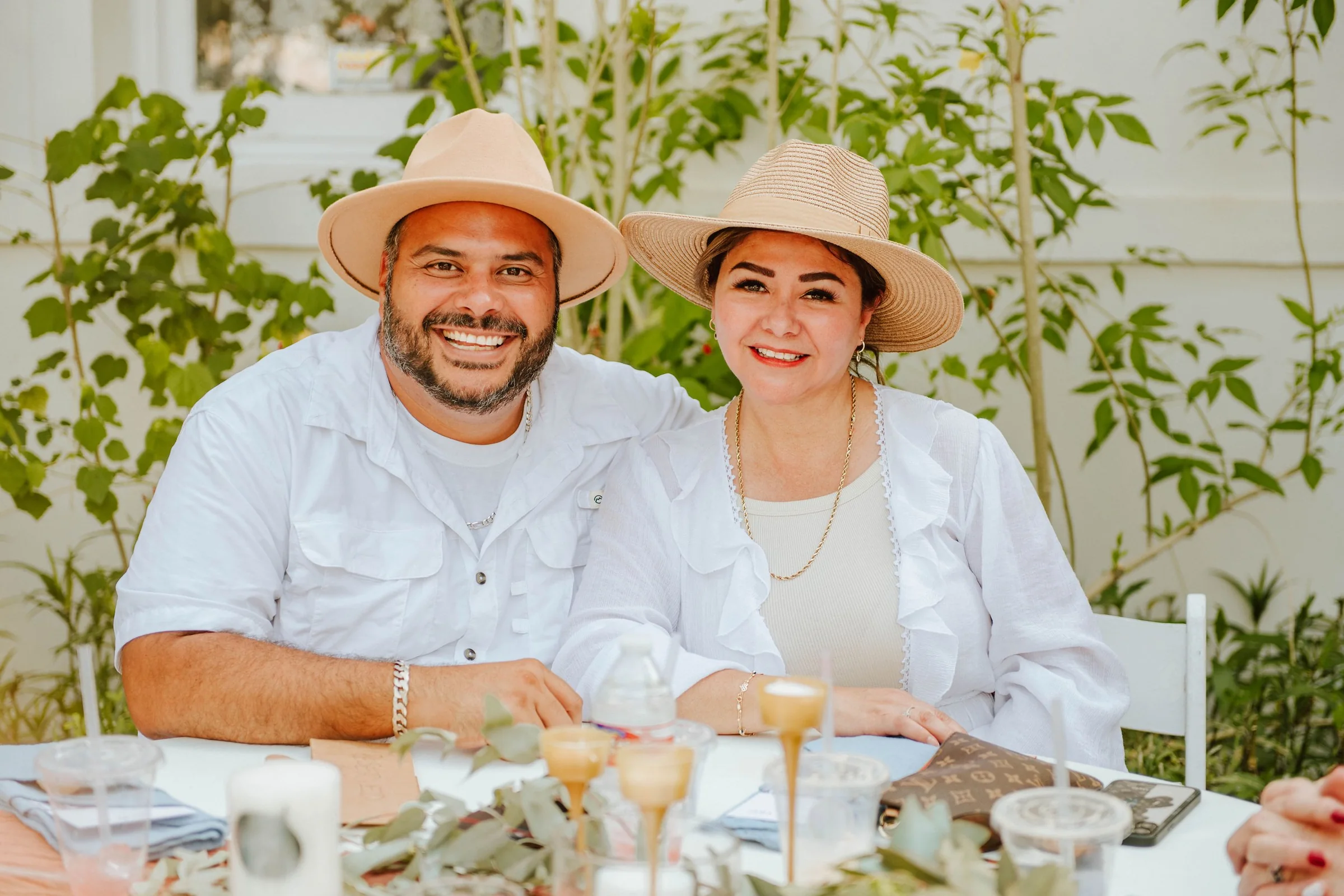 Wedding guests seated at an outdoor reception table