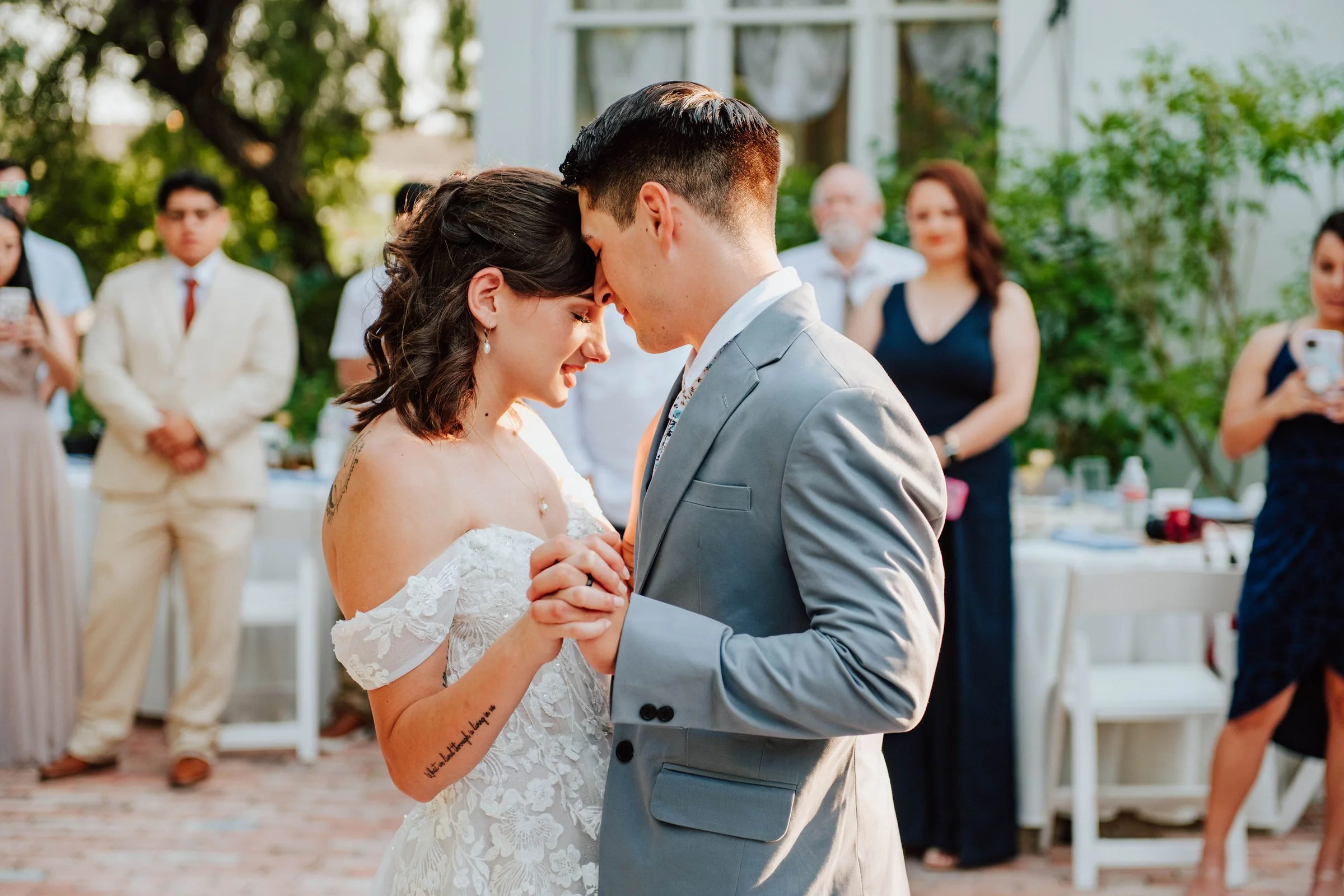 Sidney and Omar sharing a quiet wedding reception moment